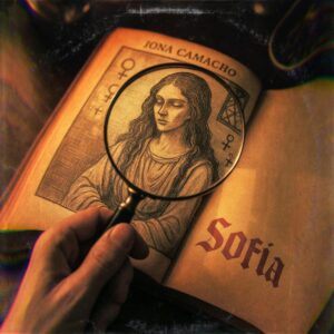 a hand holding a magnifying glass over a book